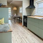 Charming Log Close To The Water And