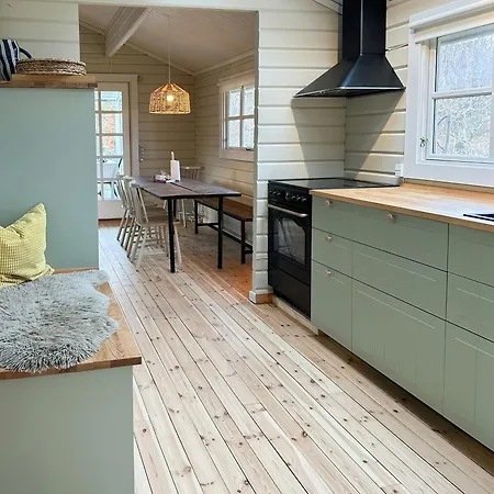 Charming Log Close To The Water And