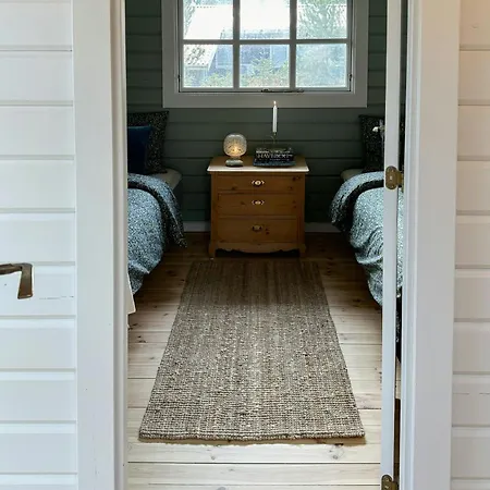 Charming Log Close To The Water And