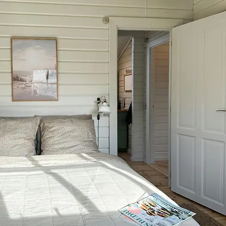 Charming Log Close To The Water And